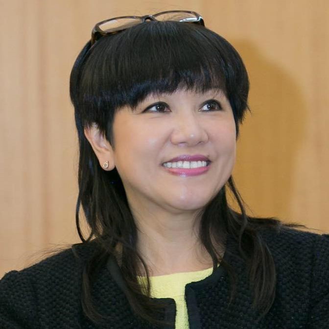 This is a headshot of Shirley Fan Chan, wearing a black jacket. 